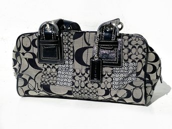 A Ladies Purse By Coach