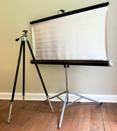 A Vintage Camera Tripod And Projection Screen