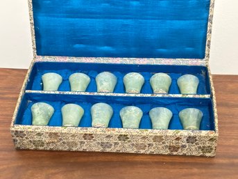 A Set Of 12 Carved Jade Shot Glasses