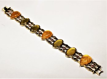 Contemporary Gold Tone Ladies Bracelet Having Glass Leaf Stones