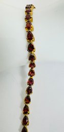 STUNNING GOLD OVER STERLING SILVER PEAR SHAPE GARNET BRACELET