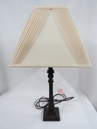 A 24' Table Lamp In A Dark Finish