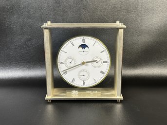 A Vintage Desk Clock By Howard Miller With Calendar & Moon Phase