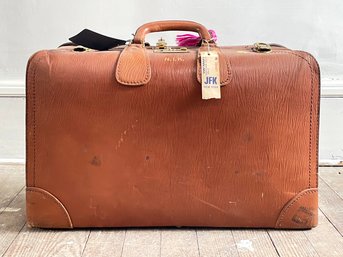 A Vintage Brown Leather Suitcase