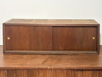 A Mid Century Modern Wall Mount Cabinet In Walnut Veneer