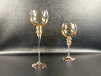 A Pair Of Amber Glass Votive Holders