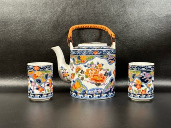 A Traditional Asian Tea Set In Ceramic, Teapot & Two Cups