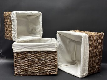 A Set Of Three Cloth-Lined Woven Baskets