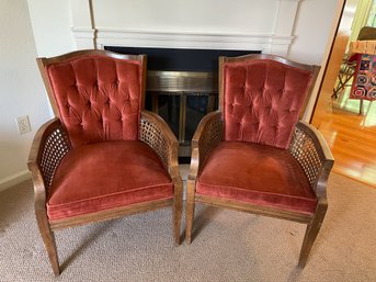 A Pair Of Mid Century Modern Tufted Arm Chairs With Caned Sides