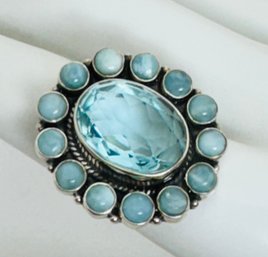 LARGE PRETTY STERLING SILVER BLUE FACETED CZ SURROUNDED BY OPAGUE STONES RING