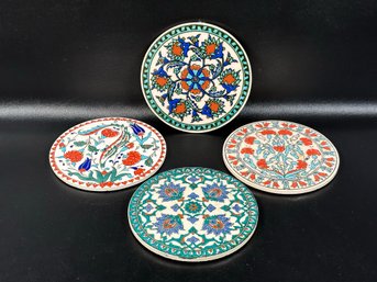 A Set Of Vintage Round Tile Trivets In Glazed Ceramic With Intricate Patterns