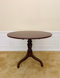 An Antique Round Tilt Top Table