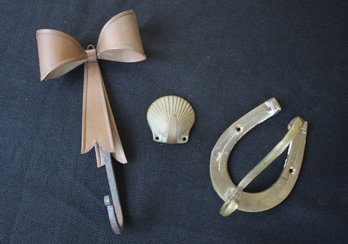 Lot Of Three Vintage Brass And Copper Wall Hooks With Clamshell, Bow And Lucky Horseshoe