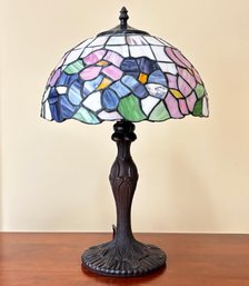 A Tiffany Style Bronze And Stained Glass Lamp