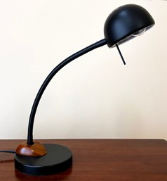 A Modern Desk Lamp In Sleek Metal And Wood