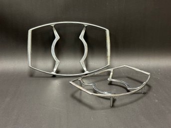 A Pair Of Metal Trivets By Corning Ware