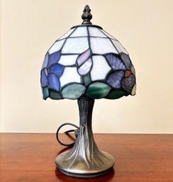 A Tifffany Style Stained Glass And Bronze Accent Lamp (Smaller)