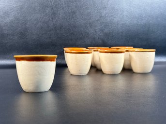 A Set Of Ten Vintage Glazed Pottery Cups With Brown Rims