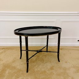 A Faux Bamboo Oval Table In Ebony And Gilt