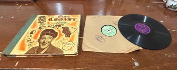 7 Vintage 78 R.P.M. Records By Okeh, Kay, Decca With Paper Record Sleeves In A Binding Like Book.