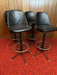 Mid Century Set Of Four Swivel And Adjustable Bar Stools