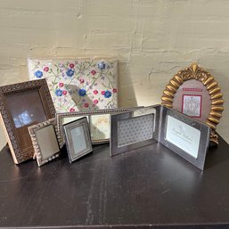 A Collection Of Photo Frames And Photo Albums