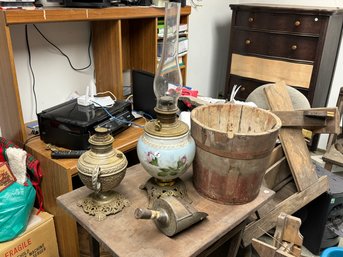 TWO VICTORIAN OIL LAMPS AND A RED SYRUP BUCKET