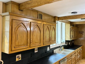 A Full Long Wall Run Of Solid Oak Cabinets With Gothic Arch Details - Uppers And Lowers