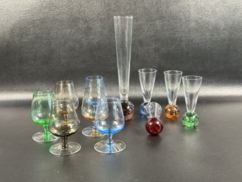 A Grouping Of Delicate Barware In Tinted Glass