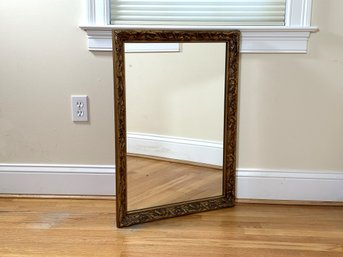 An Elegant Vintage Mirror With An Embossed Gilt Frame