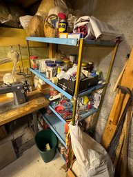 A VINTAGE MIDCENTURY METAL STORESHELF