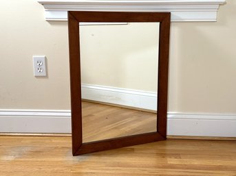 A Simple Vintage Wall Mirror In A Flat Wood Frame