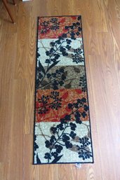 A Rubber Backed Rug Runner By Living Colors