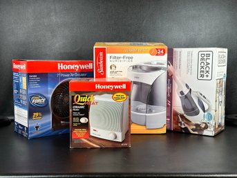 A Grouping Of New/Old Stock Household Appliances: Ceramic Heater, Humidifier, Hand Vac & More