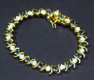 Gold Tone Tennis Bracelet Having White & Teal Gemstones About 7' Long