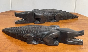 A Pair Of Carved Ebonized Wooden Crocodiles With Bone Teeth