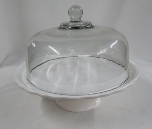 A Ceramic Cake Stand With Lid