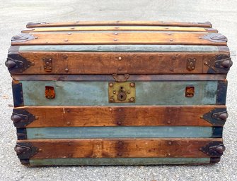 An Early 20th Century Metal Clad Wood Banded Steamer Trunk