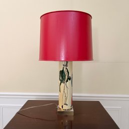 A Mid Century Soldier Table Lamp With Red Paper Shade