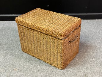 A Sturdy Rectangular Storage Basket With Lid