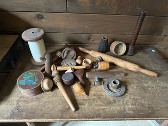 TIN FULL OF ANTIQUE WOOD PRIMITIVES, INCLUDES BUTTER PRESSES, TAPS, ETC.