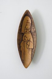 A Wood Carving Of A Woman