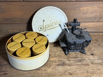 ANTIQUE TOLEWARE BOX AND A CHILDRENS CAST IRON COOKSTOVE