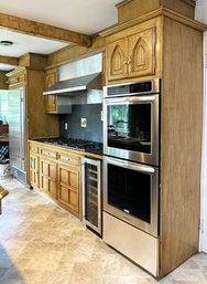 A Wall Of Solid Oak Kitchen Cabinets With Gothic Arch Details - No Appliances Included Cabinets Only