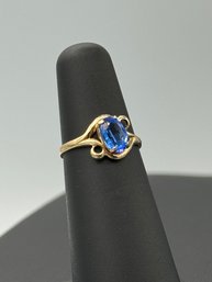 Solitaire Blue Topaz Ring In 10k Yellow Gold