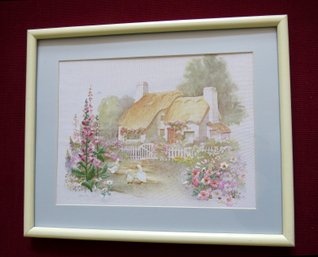 A Hand Crafted Framed Embroidery Of A Thatched Roof Cottage