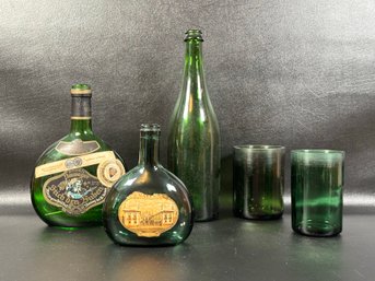 A Grouping Of Vintage Wine Bottles In Green Glass & Wine Bottle Tumblers