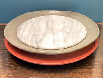 A Lazy Susan, Green Platter, And Marble Plateau