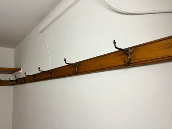 A Collection Of 14 Antique Brass Hooks On Oak Wood Bar - Bedroom 1B