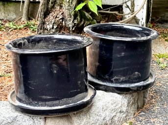 A Pair Of Glazed Earthenware Planters